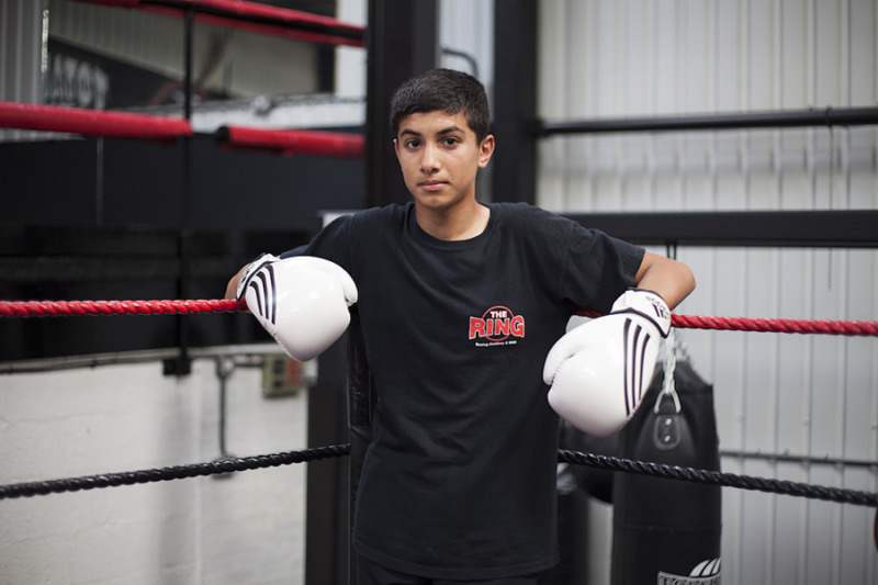 Young boy, white boxing gloves © Mahtab Hussain - You Get Me_