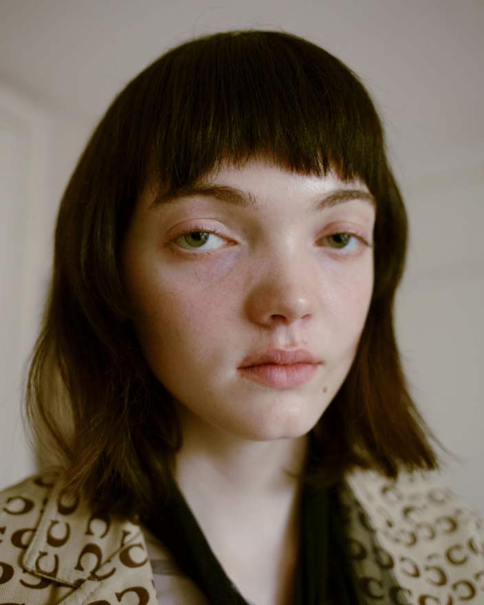 A portrait of a young girl with unusual, wide-set eyes.