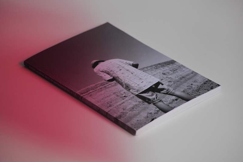 black and white cover showing a person from behind, tilting his head in front of a landscape, of paper journal best of instagram vol. 1
