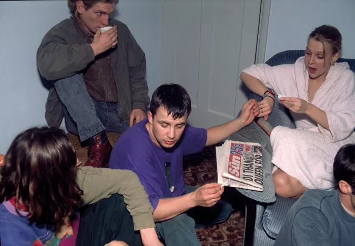 Off duty paratroopers after a rave in a living room, smoking weed, 1992