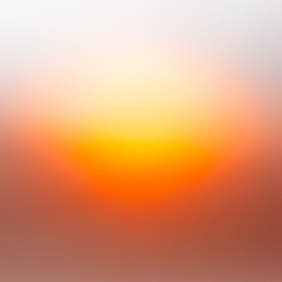 A glowing orange orb shrouded in haze.
