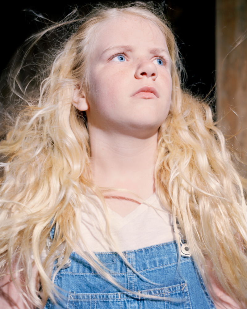 close up portrait of a girl with long blonde hair