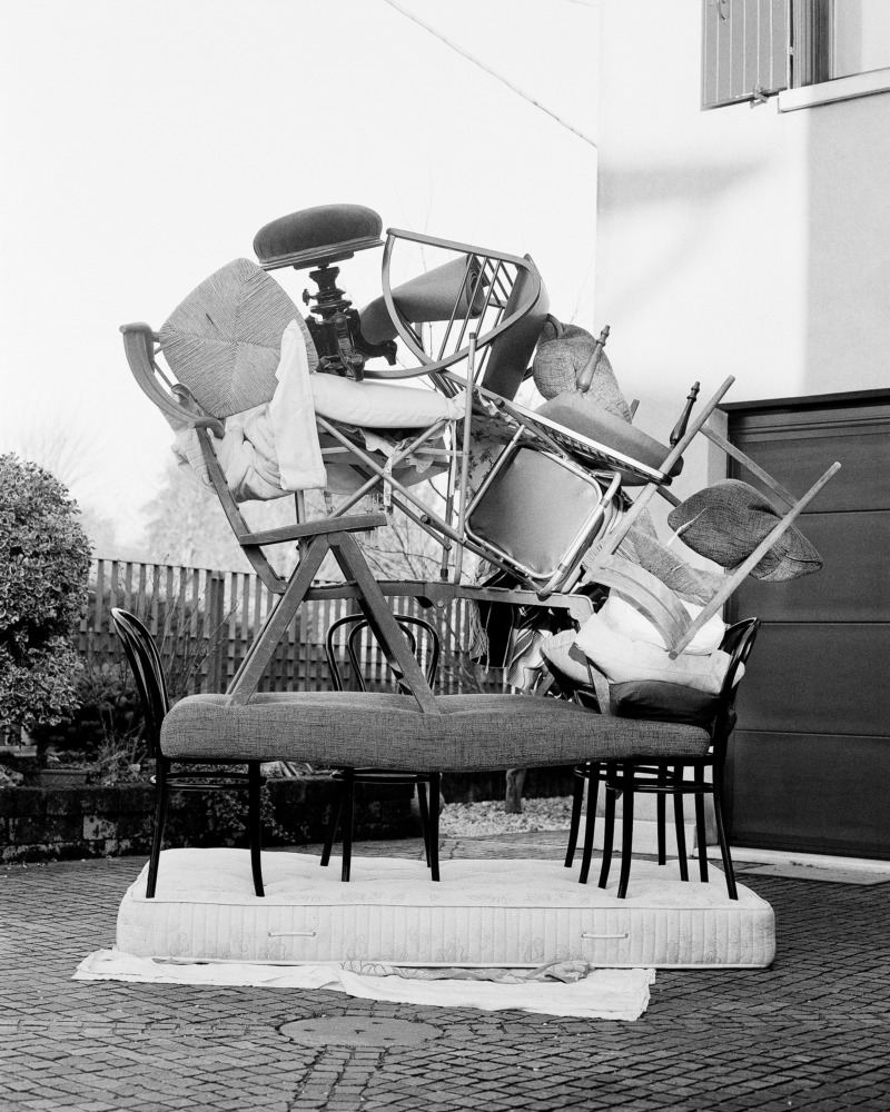 All the chairs in the Agostini house, piled in the front garden.