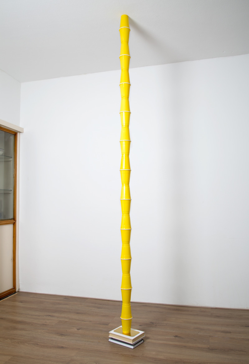 A stack of cups from floor to ceiling.