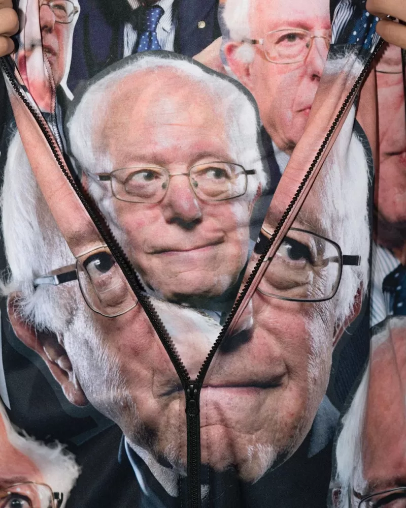 A jacket, printed with Bernie Sanders' face, is unzipped to reveal a t shirt printed with Bernie Sanders' face.